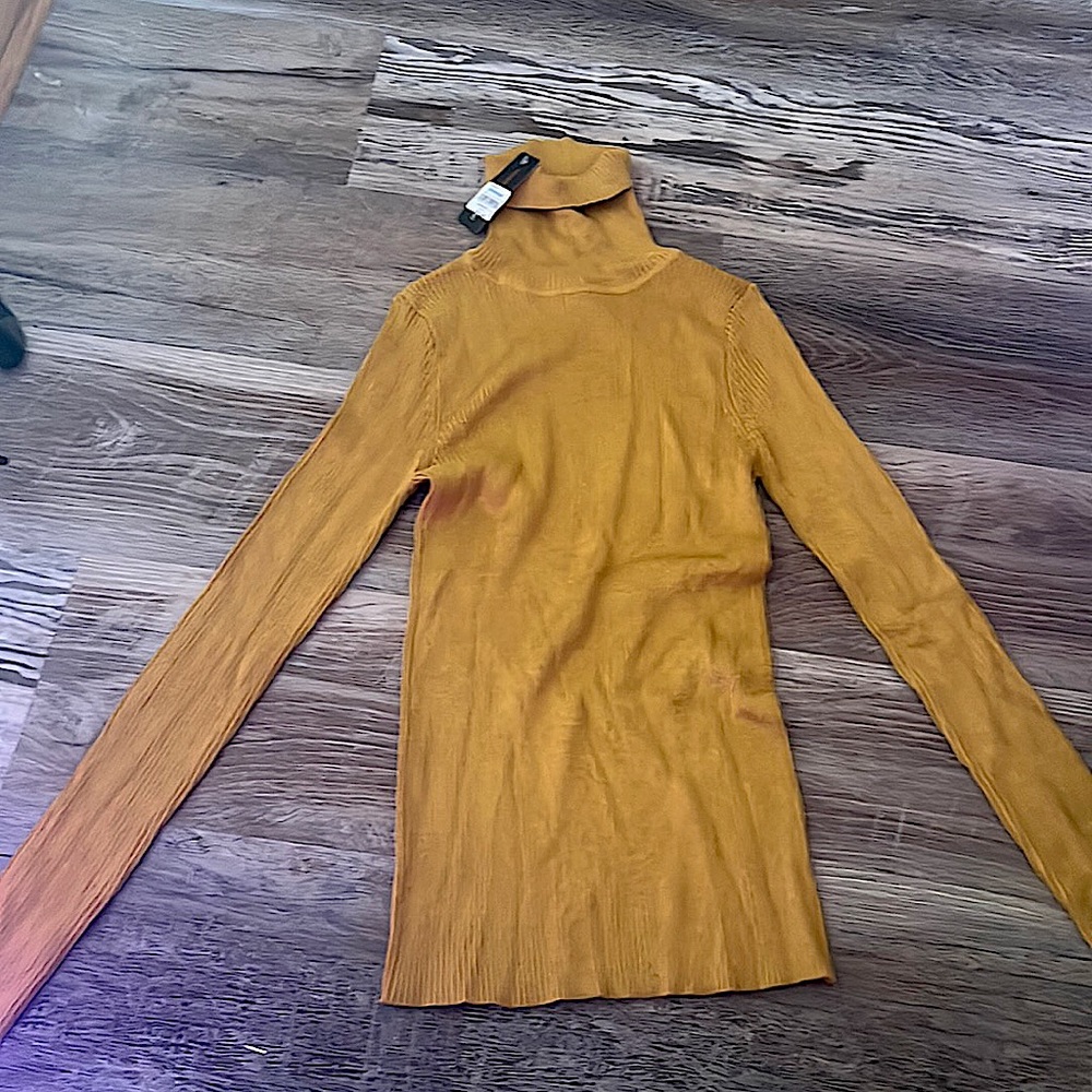 Pumpkin color turtleneck. Size Women’s Medium